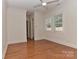 A spacious bedroom with hardwood floors, natural lighting, and crown molding at 17210 Sulky Plough Rd # 1206, Charlotte, NC 28277