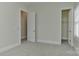 Bedroom boasting a door to an additional room and a closet at 17210 Sulky Plough Rd # 1206, Charlotte, NC 28277