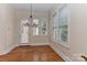 Dining room with large windows and chandelier at 17210 Sulky Plough Rd # 1206, Charlotte, NC 28277