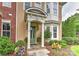 Inviting home entrance with a covered porch, manicured landscaping, and a stylish front door at 17210 Sulky Plough Rd # 1206, Charlotte, NC 28277