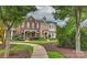 Beautiful two-story townhome with a brick and siding exterior and a landscaped walkway at 17210 Sulky Plough Rd # 1206, Charlotte, NC 28277