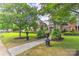 Inviting front yard with a stone path and wrought iron decorations at 17210 Sulky Plough Rd # 1206, Charlotte, NC 28277