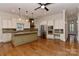 Kitchen featuring custom cabinets, granite countertops, stainless steel appliances, and hardwood flooring at 17210 Sulky Plough Rd # 1206, Charlotte, NC 28277