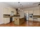Well-equipped kitchen with granite countertops, stainless steel appliances, and center island at 17210 Sulky Plough Rd # 1206, Charlotte, NC 28277