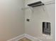 Small laundry room with wire shelving at 17210 Sulky Plough Rd # 1206, Charlotte, NC 28277