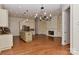 Open living space with kitchen, fireplace and access to dining area at 17210 Sulky Plough Rd # 1206, Charlotte, NC 28277