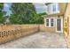 A stamped concrete patio with brick wall and view of home's back door at 17210 Sulky Plough Rd # 1206, Charlotte, NC 28277