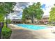 Community pool area with lounge chairs and shaded seating at 17210 Sulky Plough Rd # 1206, Charlotte, NC 28277