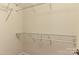 Walk-in closet featuring wire shelving and base trim at 17210 Sulky Plough Rd # 1206, Charlotte, NC 28277