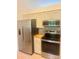 Updated kitchen with stainless steel refrigerator, oven, and decorative backsplash at 1743 Silver Stream Dr, Rock Hill, SC 29730