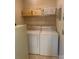 Practical laundry room with washer, dryer, and shelving for ample storage at 1743 Silver Stream Dr, Rock Hill, SC 29730