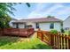 This cozy backyard features a wooden deck, grassy area and a wooden privacy fence at 1957 8Th Street Se Ln, Hickory, NC 28602