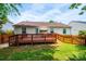 Well-maintained backyard featuring a wood deck perfect for outdoor entertaining and a partial fence at 1957 8Th Street Se Ln, Hickory, NC 28602