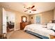 Bedroom with dresser, ceiling fan, natural light, and view of the living room at 1957 8Th Street Se Ln, Hickory, NC 28602