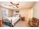 Bedroom featuring ceiling fan, natural light, bench, and floral comforter at 1957 8Th Street Se Ln, Hickory, NC 28602