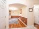 The dining room features hardwood floors, wainscoting, a chandelier, and an area rug at 1957 8Th Street Se Ln, Hickory, NC 28602