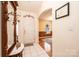Inviting entryway featuring white tile floors, a decorative mirror, and an archway to other rooms at 1957 8Th Street Se Ln, Hickory, NC 28602