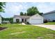 Inviting single-story home with a well-kept lawn and an attached two car garage at 1957 8Th Street Se Ln, Hickory, NC 28602