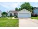 Charming home with a well-manicured lawn, tidy landscaping, and a two car garage at 1957 8Th Street Se Ln, Hickory, NC 28602
