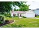 Charming single-story home featuring a well-manicured lawn and attached two car garage at 1957 8Th Street Se Ln, Hickory, NC 28602