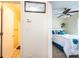 Hallway view of the bathroom and bedroom featuring ceiling fan and bed at 1957 8Th Street Se Ln, Hickory, NC 28602
