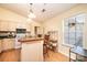 Bright kitchen with a center island and adjacent eating nook by a stained-glass window at 1957 8Th Street Se Ln, Hickory, NC 28602