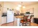 Cozy kitchen features wood floors, breakfast bar with seating, and neutral cabinets at 1957 8Th Street Se Ln, Hickory, NC 28602