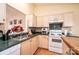 Functional kitchen featuring a double sink, wood cabinets, and a white range stove at 1957 8Th Street Se Ln, Hickory, NC 28602