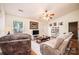 Comfortable living room with plush sofa, TV, ceiling fan, and neutral decor at 1957 8Th Street Se Ln, Hickory, NC 28602