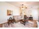 Bright living room with neutral walls, ceiling fan, plush sofa, and decorative rug at 1957 8Th Street Se Ln, Hickory, NC 28602