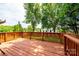 Spacious wooden deck, perfect for outdoor entertaining or relaxing, surrounded by lush greenery at 1957 8Th Street Se Ln, Hickory, NC 28602