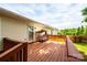 Outdoor wood deck with a canopy swing and partial privacy fence, perfect for enjoying the outdoors at 1957 8Th Street Se Ln, Hickory, NC 28602