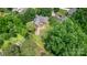 Aerial view showcases the home's backyard featuring a wooden deck, lovely landscaping, and serene outdoor space at 2005 Schofield Pl, Salisbury, NC 28144
