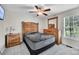 Cozy bedroom with neutral carpet and furnishings, and natural light from a window at 2005 Schofield Pl, Salisbury, NC 28144