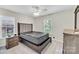 Cozy bedroom with neutral carpet and furnishings, and natural light from two windows at 2005 Schofield Pl, Salisbury, NC 28144