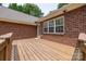 Wooden deck area attached to a brick home, offering space for outdoor entertaining and relaxation at 2005 Schofield Pl, Salisbury, NC 28144