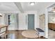 Inviting foyer with wood floors, a storage bench, and a view of the dining area at 2005 Schofield Pl, Salisbury, NC 28144
