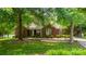 Charming red brick home featuring a well-maintained lawn and mature trees, enhancing curb appeal at 2005 Schofield Pl, Salisbury, NC 28144