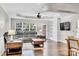 Cozy living room featuring hardwood floors, a large sectional sofa, and built-in shelves at 2005 Schofield Pl, Salisbury, NC 28144
