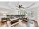 Comfortable living room with a grey sectional, hardwood floors, and a ceiling fan at 2005 Schofield Pl, Salisbury, NC 28144