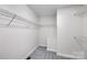 Empty walk-in closet with wire shelving and neutral carpet and paint providing a blank canvas for storage at 2005 Schofield Pl, Salisbury, NC 28144