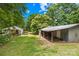 Large backyard featuring grass and outbuildings at 208 Lipe Rd, Troutman, NC 28166