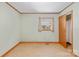 Simple bedroom featuring light green walls, trim, and a window with curtains at 208 Lipe Rd, Troutman, NC 28166