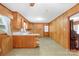 Functional kitchen featuring wood cabinets, vintage countertops, and linoleum flooring at 208 Lipe Rd, Troutman, NC 28166