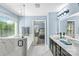 Bright bathroom features marble floors, double sink vanity, garden tub, and glass shower at 2213 Iron Works Dr, Clover, SC 29710