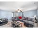 Spacious living room with large sectional sofa, area rug, and lots of natural light at 2213 Iron Works Dr, Clover, SC 29710