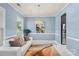 Inviting sitting room with blue walls, classic trim, and a refrigerator or wine cooler at 2213 Iron Works Dr, Clover, SC 29710