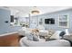 Open-concept living room with a modern kitchen, breakfast nook, lots of seating, and a large television at 2213 Iron Works Dr, Clover, SC 29710