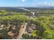 Breathtaking aerial view of a lakeside community surrounded by lush green forests and serene waterways at 240 Bells Crossing Dr, Mooresville, NC 28117