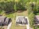 Aerial shot of home surrounded by mature trees on a large lot at 240 Bells Crossing Dr, Mooresville, NC 28117